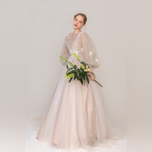 Elegant Cream Tulle Wedding Gown with Floral Details